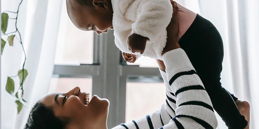 mother is holding baby